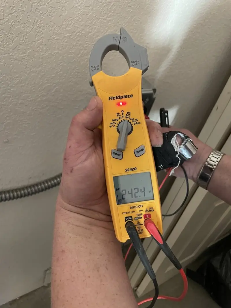 Voltage testing with clamp meter during Whole House Surge Protector in Farmingdale